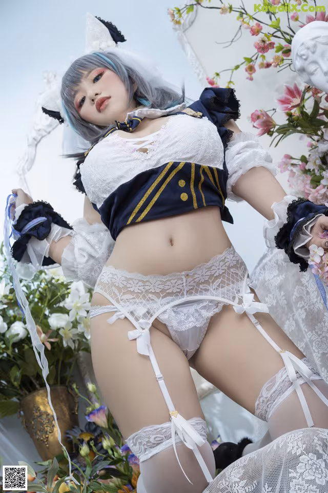 A woman in a white and blue outfit posing for a picture.