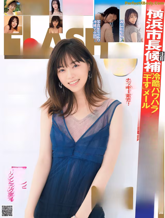 A woman in a blue dress on the cover of a magazine.